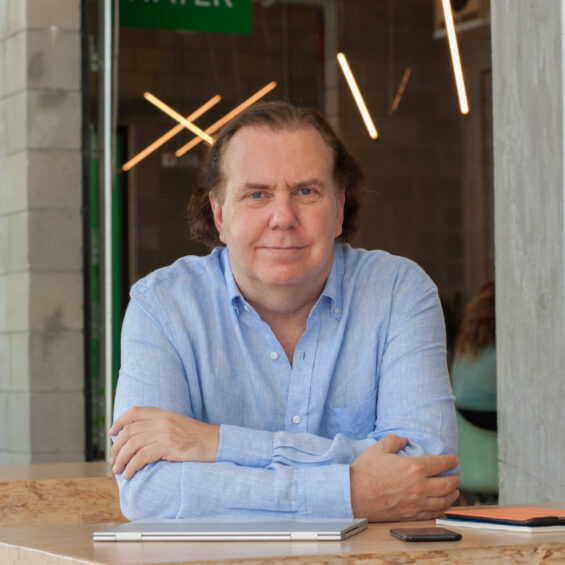 Andy Abramson, Chief Marketing Officer of JouleFit, sitting and resting his hands on a table.