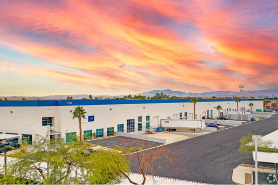 Colorful orange, blue and purple sunrise above a white and blue industrial  facility | Caltrol, Inc., Clark County, Nevada